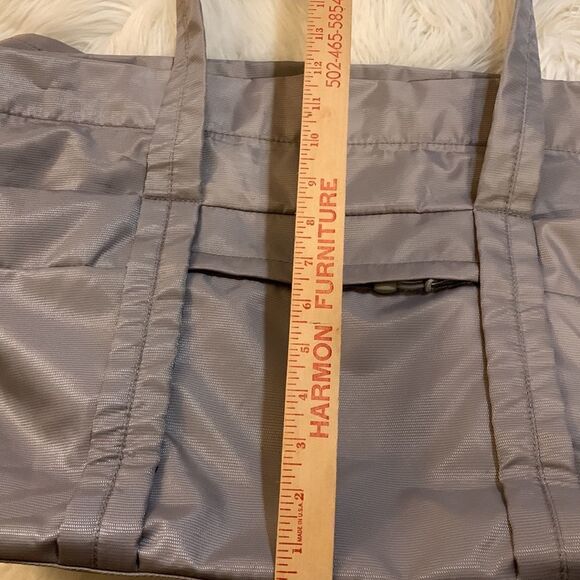 Large gray tote with outside pockets all the way around including one zippered. - Picture 11 of 12